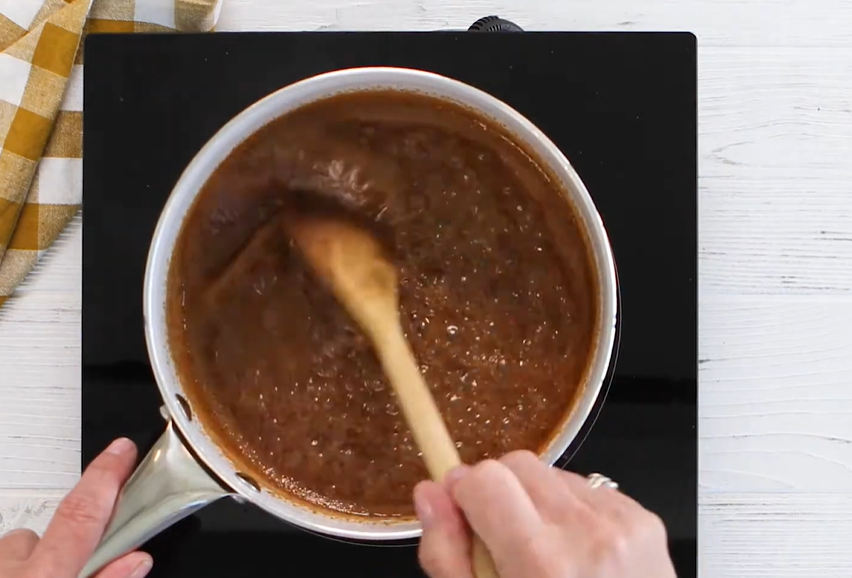 mixing brown butter and sugar