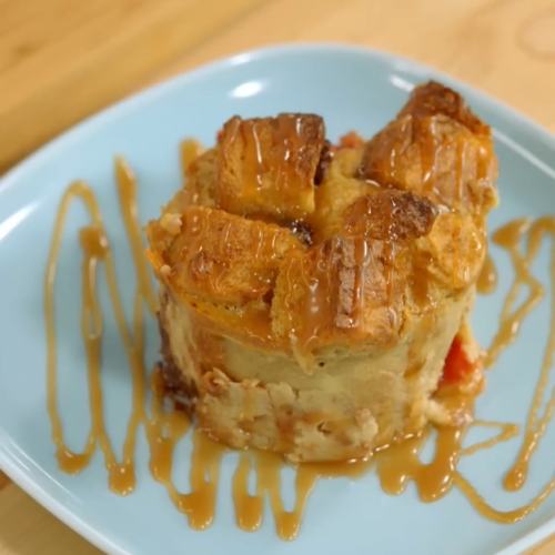 a plate of VANILLA BREAD PUDDING on a table