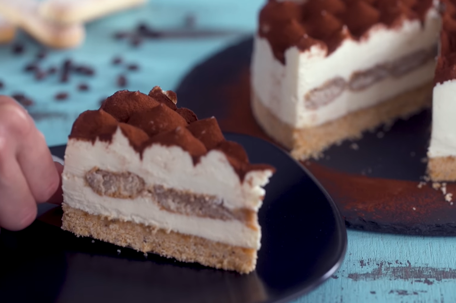 a piece of BAKED TIRAMISU CHEESECAKE on a plate