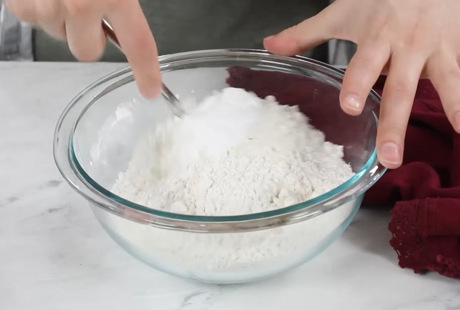 Add the flour, baking powder, baking soda, and salt, then fold with a spatula until the flour is nearly incorporated.






