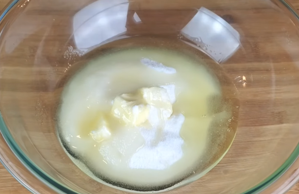 the sugar, melted butter and oil in a bowl