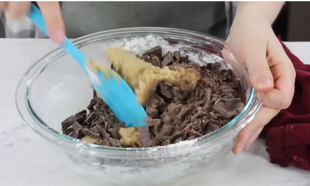 Mix in the chopped chocolate! At this stage, the dough should be cool enough to prevent the chocolate from melting.






