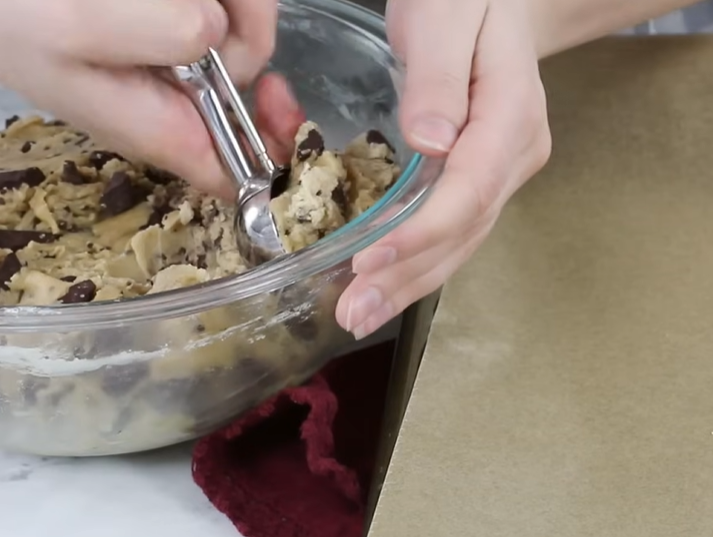 Use a cookie scoop to divide the dough, each weighing around 80g. These will result in large, delightful cookies!
