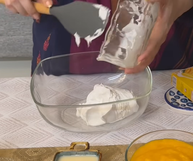 In a glass bowl, whisk together cream cheese and sugar until the mixture becomes creamy