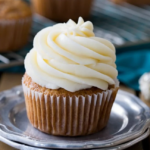 Delicious cupcake topped with a smooth layer of cream cheese frosting